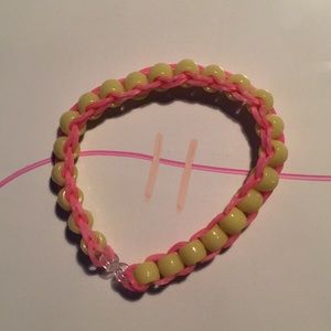 Pink band yellow bead